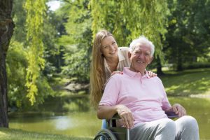 elderly-man-in-wheelchair-with-girl